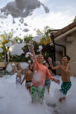 Kids playing in foam at a Los Angeles foam party rental